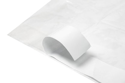 Mattress protector with adhesive tape